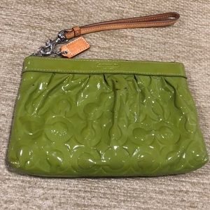 Coach Patent leather wristlet.